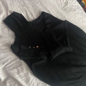 Black Turtlneck sweater with gold buttons on sleeves
